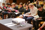 003 2018 contestants examining the program book