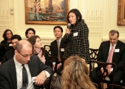 Patty Ju Lee (77-86) speaking to Alumni